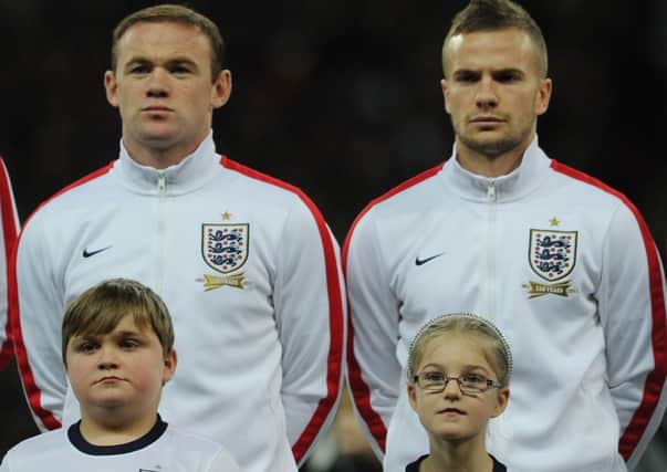 Lewis Marshall from St Annes (in front of Wayne Rooney) ahead of the Germany game. Tom Cleverley is next to Rooney