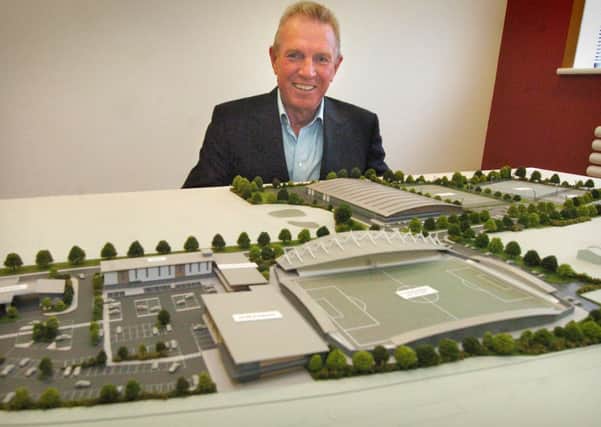 Chairman of Tangerine Holdings and AFC Fylde David Haythornthwaite today unveiled a model and plans for a new sports and retail complex near the M55 at Wesham, which includes a new stadium for AFC Fylde.
David with the architect's model.  PIC BY ROB LOCK
3-9-2013