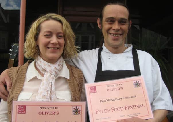 Oliver Sinclair and staff member Angela Richards with their certificates as winners of the best restaurant award at the 2013 Fylde Food Festival.