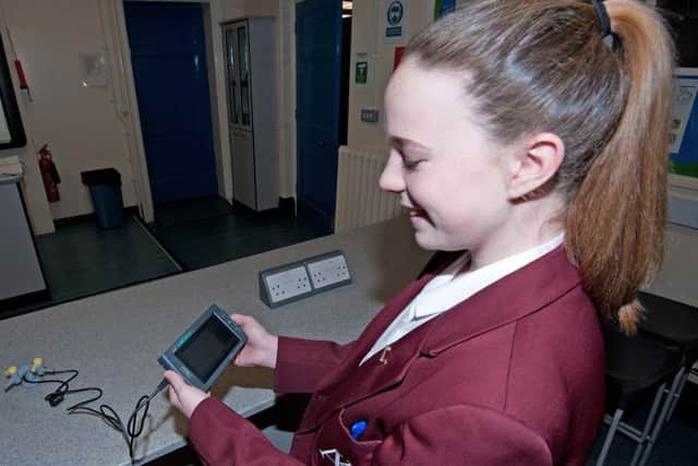 Pupil Jessica Heaton using the equipment the school bought with its prize from the Young Engineers challenge.  Pictures: John McVittie.