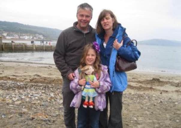 Lost camera picture of Mick and Claire Speakman with daughter Ella, nine.