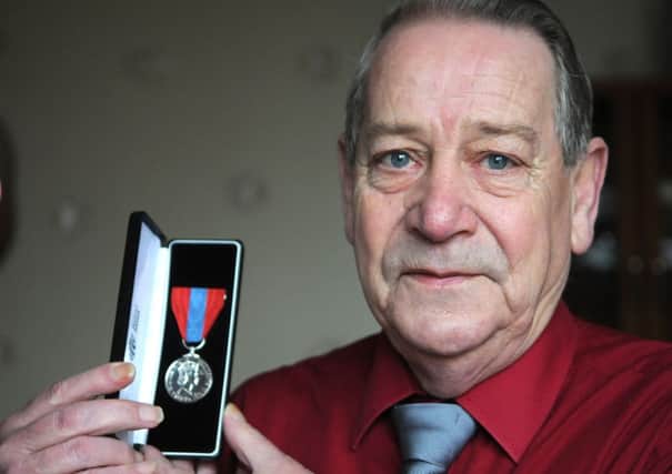 Coun Keith Beckett with the award he received from the Governor of Kirkham Prison.