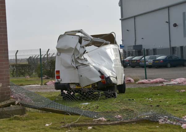 A van was destroyed after being hit by falling debris near to Blackpool Airport. Below: Emporium in Clifton Street.