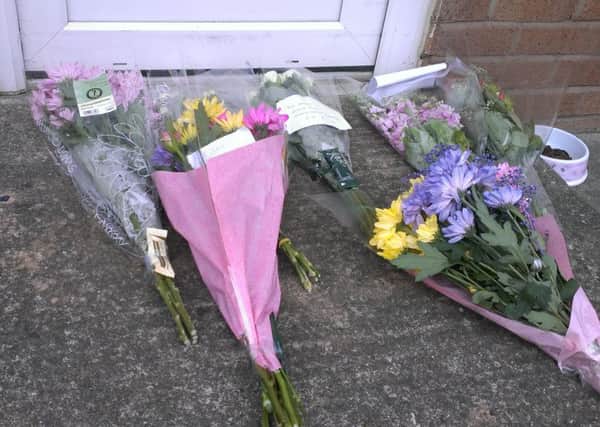 Flowers left outside a flat on Clover Avenue, St Annes, where a man died in a fire on Friday, May 2