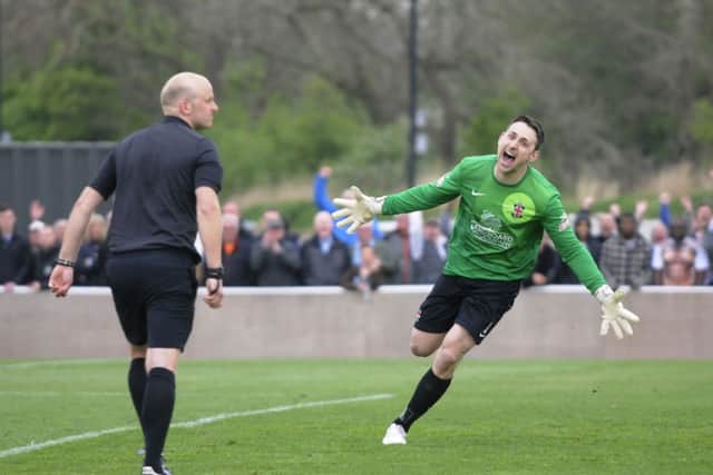 AFC Fylde win promotion after playing Ashton United.  Ben Hincliffe celebrates after scoring the winning penalty.