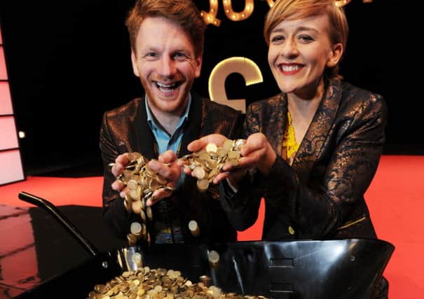 Casino and Queenie, played by Brian Ferguson and Lucy Ellinson, with the £10,000 of pound coins for the Money Games Show.