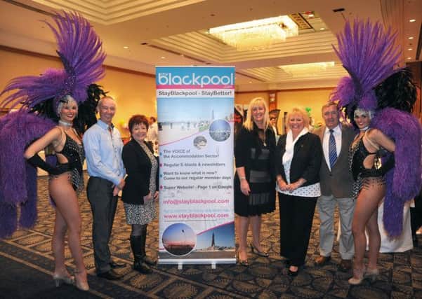 Stay Blackpool held its annual conference at the Hilton Hotel.
Pictured with Viva showgirls Alana Stevens (left) and Kayleigh Spencer are Stay Blackpool board members L-R: Paul Ward, Helen Mansell, Claire Smith, Shirley Hunt and Mick Grewcock.  PIC BY ROB LOCK
7-5-2014