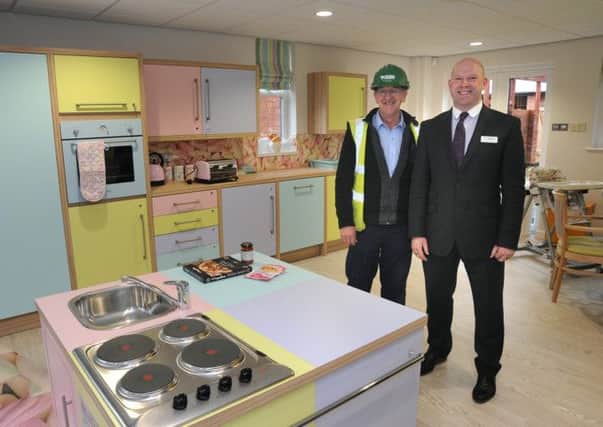 Funds boost for Hospice Heroes Appeal, pictured is site manager Christopher Mulcahy (left) and facilities manager Simon Hellawell in the new kitchen at Brian House. (below) rock legend Rod Stewart