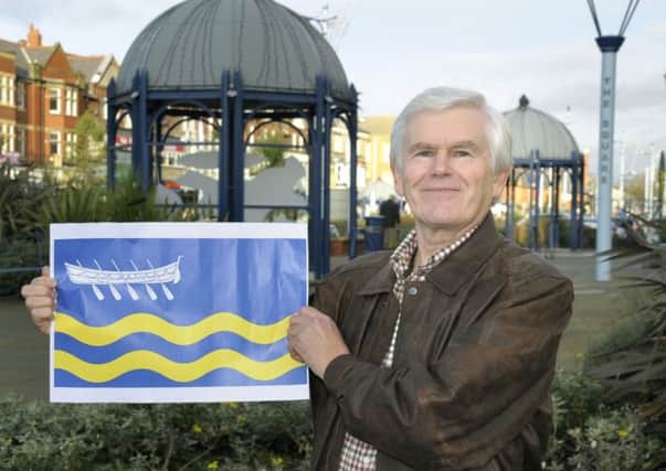 Councillor Vince Settle in St Annes Square, with the St Annes flag design.