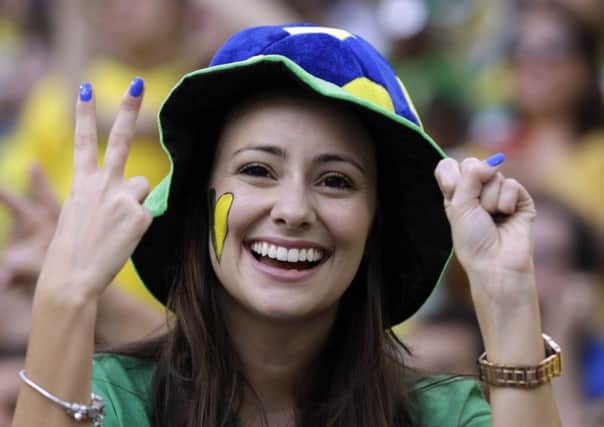 A supporter gestures before the group F World Cup soccer match between Iran and Nigeria)