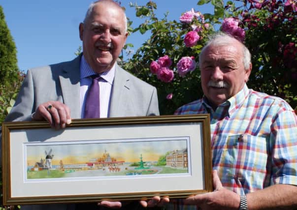 Artist Geoff Winch (left) with Lytham St Annes Twinning Association chairman Tony Ford and a painting Geoff has prepared specially for the 30th anniversary of twinning with Werne