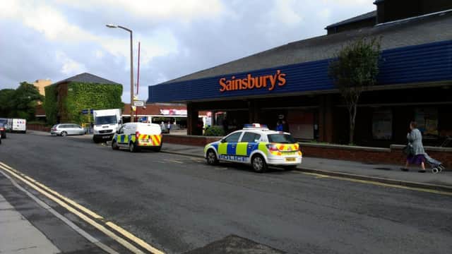 Police outside Sainsbury's after the raid