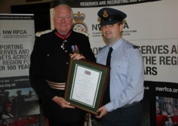 Heros Commendation: Colonel The Lord Shuttleworth KCVO, Her Majestys Lord-Lieutenant of Lancashire, presents the award to Flight Lt John Sutcliffe