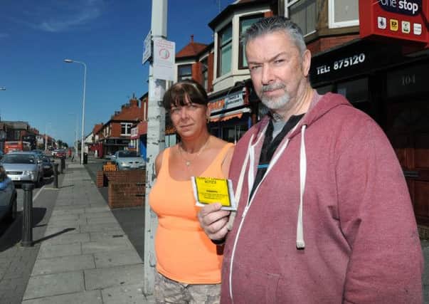 Clinton and Elaine Walker, who run the Candy Shack and Castaway shops on Poulton Road, Fleetwood, claim parking regulations are being unfairly enforced on the street. Photo: Rob Lock