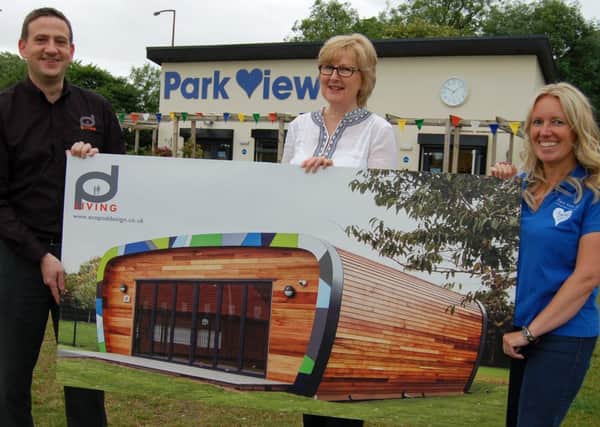 Left Phil Doleman from Pod Living, centre Jane Pinnock, a trustee of Soroptimist (Fylde ) Limited and right Julie Norman  Park View 4US Forest School practitioner with the new-look education centre plans.