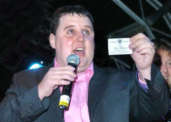 Blackpool illuminations Switch-On 2006 at Bonny Street Car Park. Peter Kay holding up the Mayor of Blackpool 's business card./news
