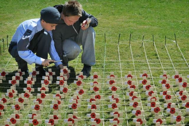 Cadets from all three forces stood guard throughout the day at Blackpool cenotaph marking the 100th anniversary of the start of the First World War.
Cadets add more crosses to the ranks.  PIC BY ROB LOCK
4-8-2014