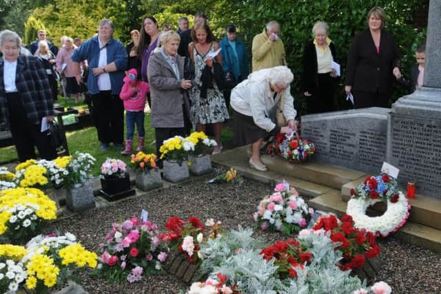 Photo: David HurstService held in Holy Trinity CC Church grounds to commemoratethe 70th anniversary of the Freckleton Air DisasterCrowds show their respects after the service