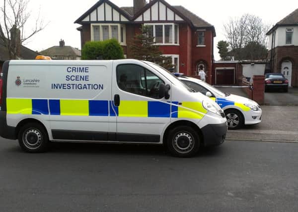 Crime scene: Police outside the house in Blackpool Road North , St Annes, where Stefan and Janek Martens lived