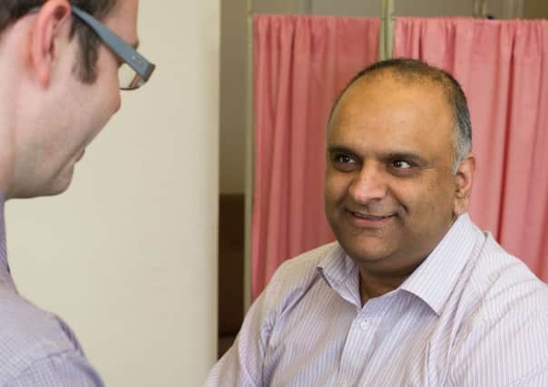 Lancashire County Councillor Azhar Ali undergoes his free health check
