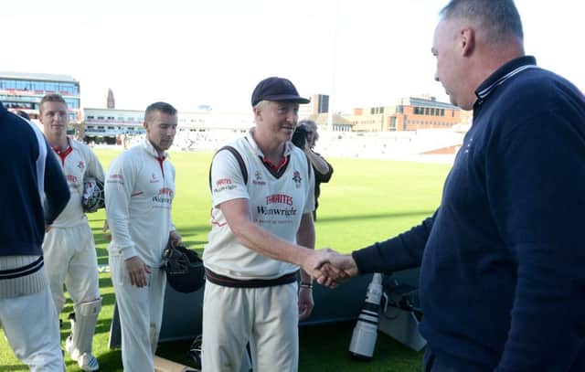 Lancashire's Glen Chapple shakes hands with Angus Fraser, after their match with Middlesex ends in a draw, during day four of the LV= County Championship match at Old Trafford, Manchester. PRESS ASSOCIATION Photo. Picture date: Friday September 26, 2014. See PA Story CRICKET Lancashire. Photo credit should read: Martin Rickett/PA Wire.