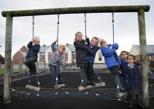 Lancashire's third driest September in over 100 years- Year 1 pupils at St Nicholas CE Primary School in Marton have fun on the Trim Trail, with L-R: Sean, William, Mya, Cruz, Mena, Kai and Gemma.  PIC BY ROB LOCK 8-10-2014