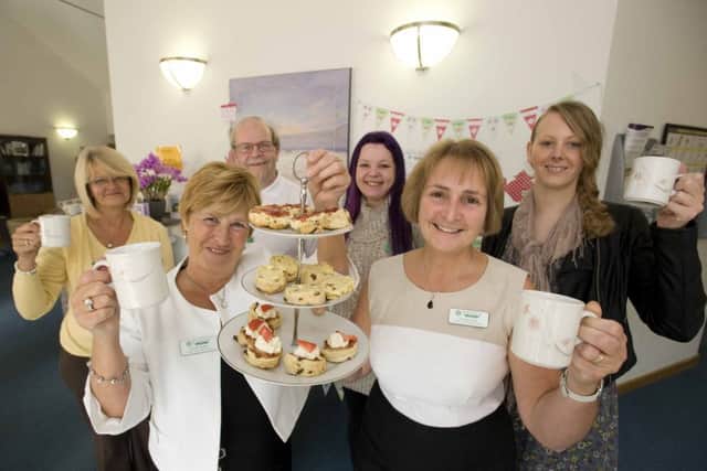 Big cheers: Sandra Cheston and Owenna Jones with volunteers, from left, Jan Lumby, Gavin Quick, Kat Hilton and Sara-Jane McLeish at the open day
