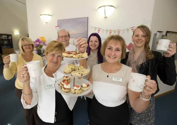 Big cheers: Sandra Cheston and Owenna Jones with volunteers, from left, Jan Lumby, Gavin Quick, Kat Hilton and Sara-Jane McLeish at the open day