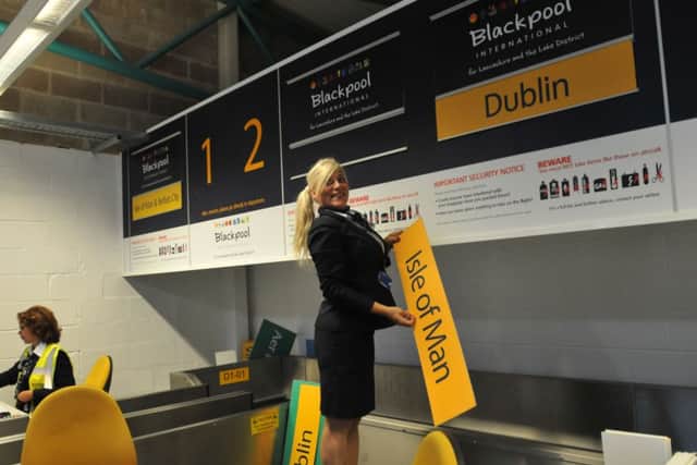 The closure of Blackpool Airport:  Donna Knuttal takes down the boarding sign