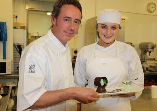 Bake off: Twelve restaurant chef and owner Paul Moss with catering student Elizabeth Watson, and the mint chocolate dessert she designed to be sold at Blackpool and The Fylde Colleges new restuarant Level Six, set to be opened in the New Year