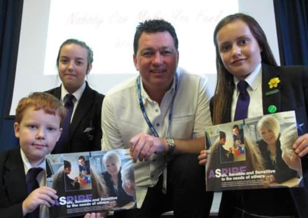 Anti- bullying: Entertainer Norry Ashcroft, AKA Lionel Vinyl, has been visiting Blackpool schools to give motivational talks about 
anti-bullying initiatives - he is pictured with Aspire Academy pupils Michael Lakeman, Leah Lavelle and Nicola Barber