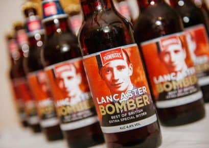 Specially designed bottles of Thwaites' Lancaster Bomber ale featuring a picture of Blackpool war veteran Ron Marlow in uniform.