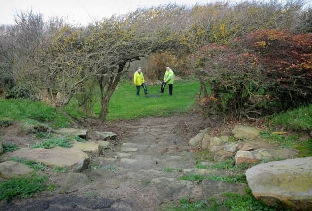 Fylde Borough Council are hoping to win a grant to uncover and renovate the 'lost gardens' next to Fairhaven Lake in Ansdell.
Workers Stuart Bimpson (right) and John Musson in an area of the gardens.  PIC BY ROB LOCK
17-11-2014