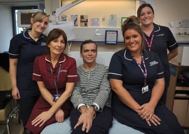 So lucky: Chris recuperating at Blackpool Victoria Hospital with his saviours, bowel cancer screening practitioners Marie Young, Louise Newton, Lindsey Siddall and Charlie Cookson