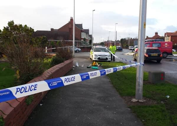Crime scene: Police seal off the street where the 66-year-old woman was attacked