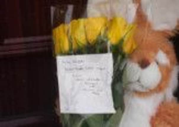 Tributes were left outside the home of four-week-old Freddie Neil who died on Boxing Day.