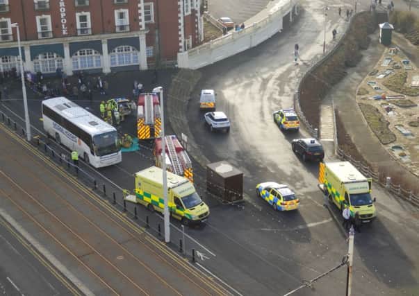Crash drama: Two people were trapped under the coach close to the Metropole
 Picture: Stuart Reynolds