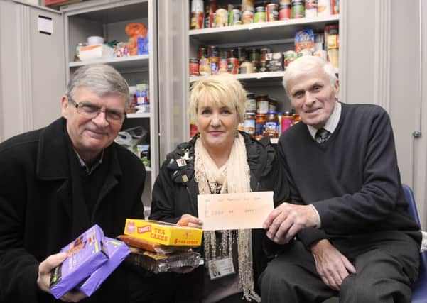 Timely boost: Lancashire County Council has donated £5,000 to Fleetwood Food Bank.  Pictured are Alan Vincent, Lorraine Beavers and Ken Hayton