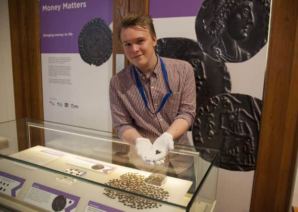 Money matters: Matt Ball of the Harris Museum with the Roman coins