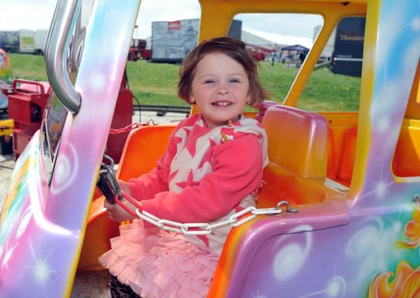 Scarlett Challies, two, on a ride at the family fun day, part of the St George's Day Festival, at Lytham St Annes.