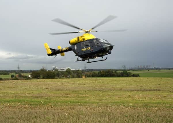 A police helicopter in action in South Yorkshire