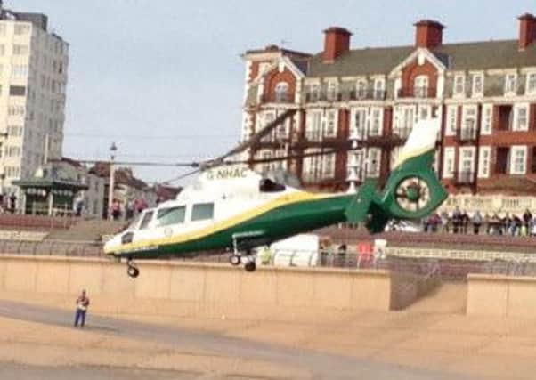 The air ambulance takes off from the Promenade after picking up the injured victim.
