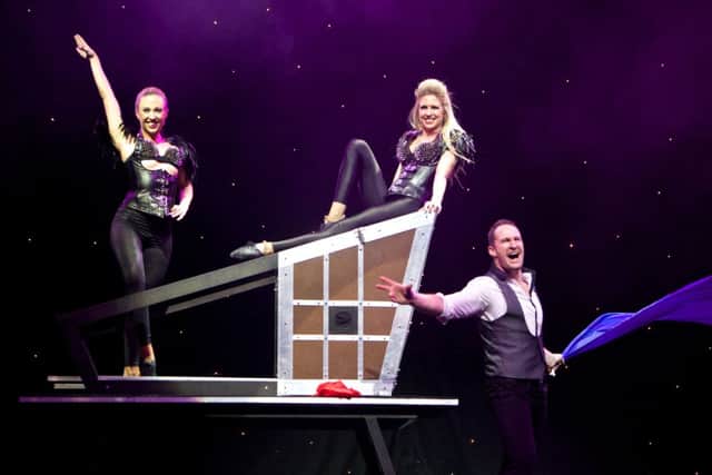 Illusionist Matthew McGurk with his glamourous assistants