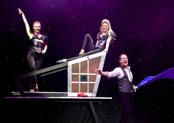 Illusionist Matthew McGurk with his glamourous assistants