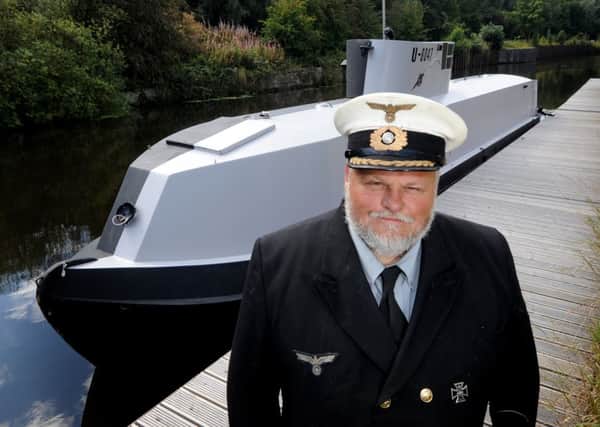 Richard Williams with his narrow boat which he turned into a replica U-boat