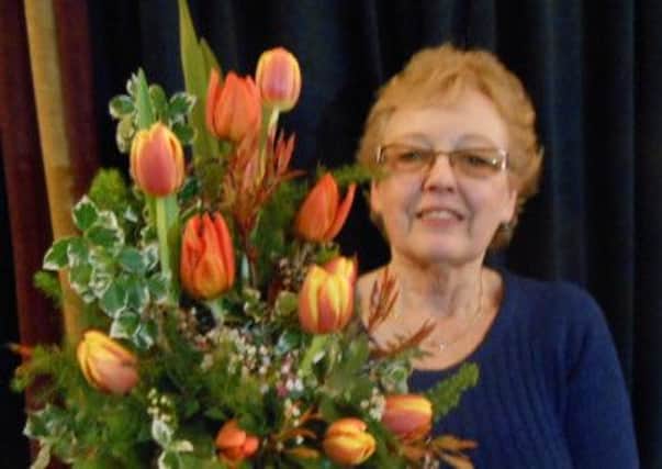 Mary Thornber with her winning spring arrangement at Garstang Gardening Club's spring show