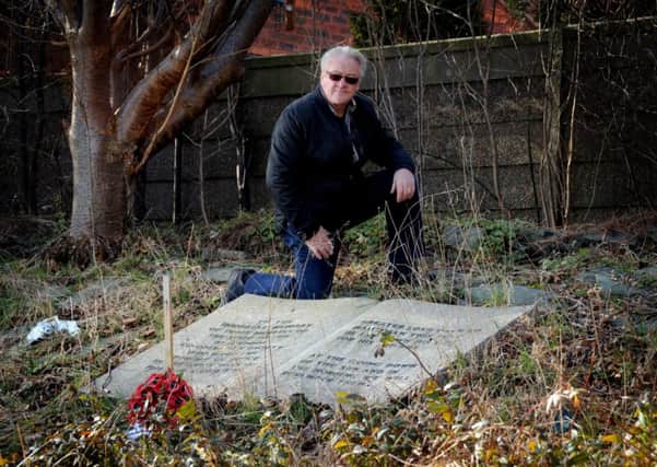 Local historian Mike Coyle by a derelict war memorial in the grounds of the former Co-Operative Sports and Social Club on Preston New Road in Marton, Blackpool