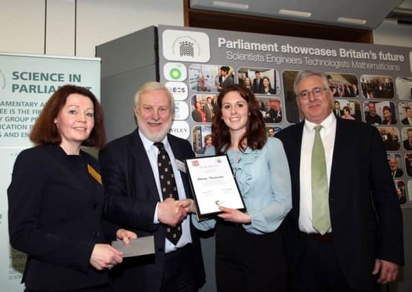 Natalie Theodoulou receiving her award from Andrew Miller MP, chair of the Parliamentary & Scientific Committee