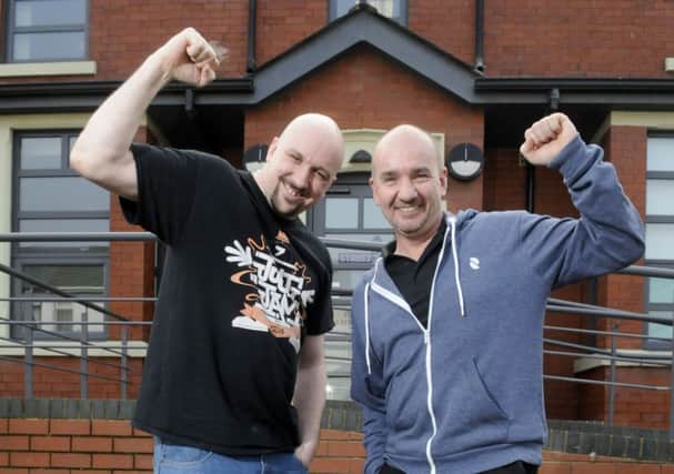 Streetlife youth worker Lee Abbott and shelter team leader Pete Tomkinson celebrate after the charity was handed a cash boost of more than £430,000