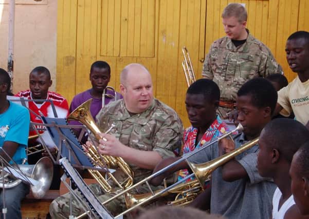 Corporal Wayne Filer of the Band of The Kings Division, coaching during the Brass For Africa workshop
